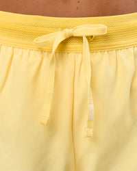 Woman wearing Accelerate 3" Mid-Rise Running Short - Sunbeam-Lemon | Model:Bianca | Size:S | Thumbnail Index: 8