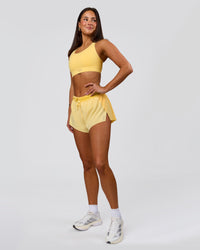 Woman wearing Accelerate 3" Mid-Rise Running Short - Sunbeam-Lemon | Model:Bianca | Size:S | Thumbnail Index: 10