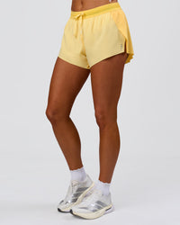 Woman wearing Accelerate 3" Mid-Rise Running Short - Sunbeam-Lemon | Model:Bianca | Size:S | Thumbnail Index: 12