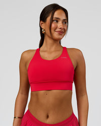 Woman wearing Accelerate Sports Bra - Scarlet | Model:Bianca | Size:S
