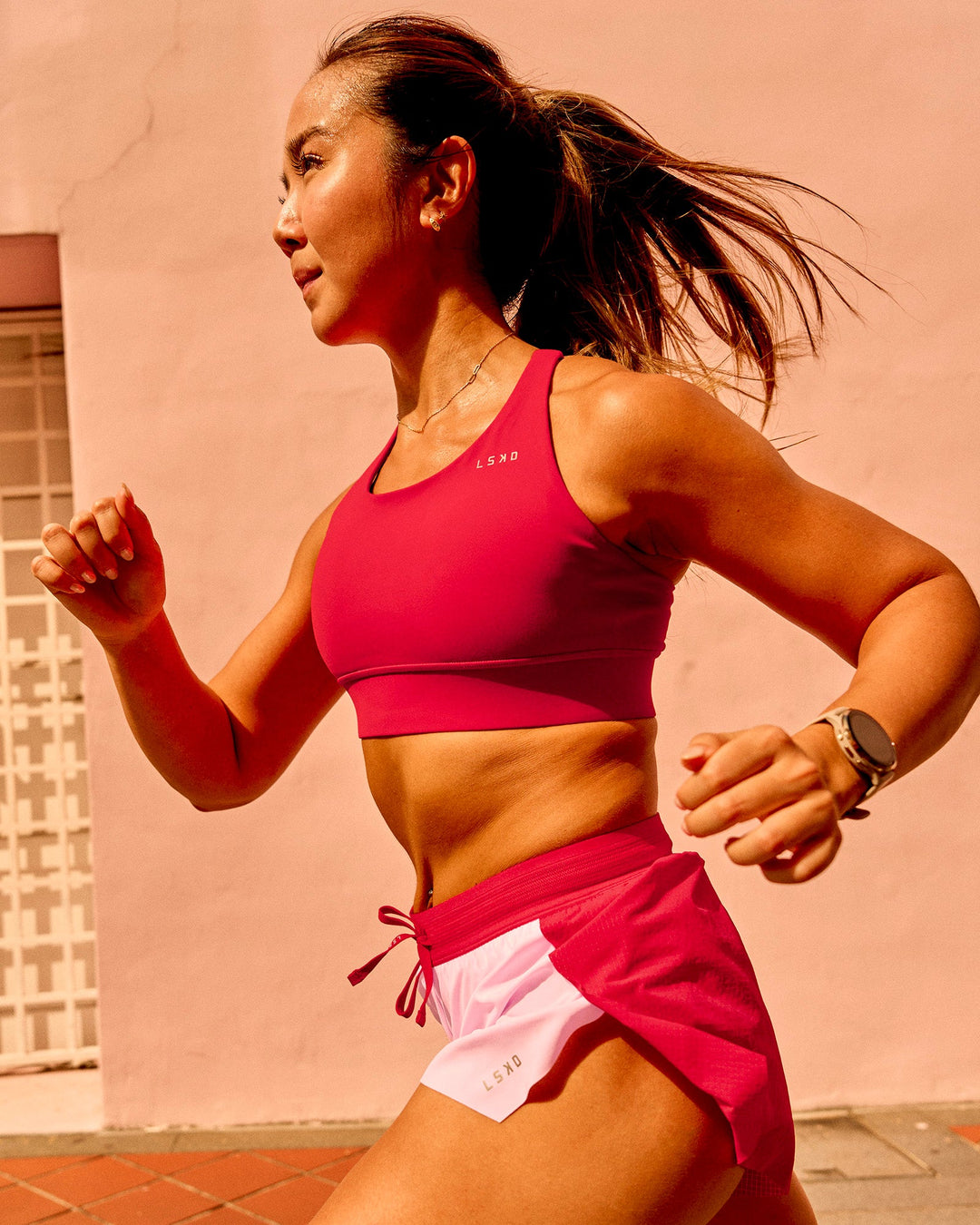 Woman wearing Accelerate Sports Bra - Scarlet | Model:Bianca | Size:S