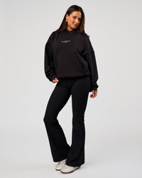 Woman wearing Andrew J. Steel x LSKD Boxy Hoodie - Black | Model:Bianca | Size:S | Thumbnail Index: 7