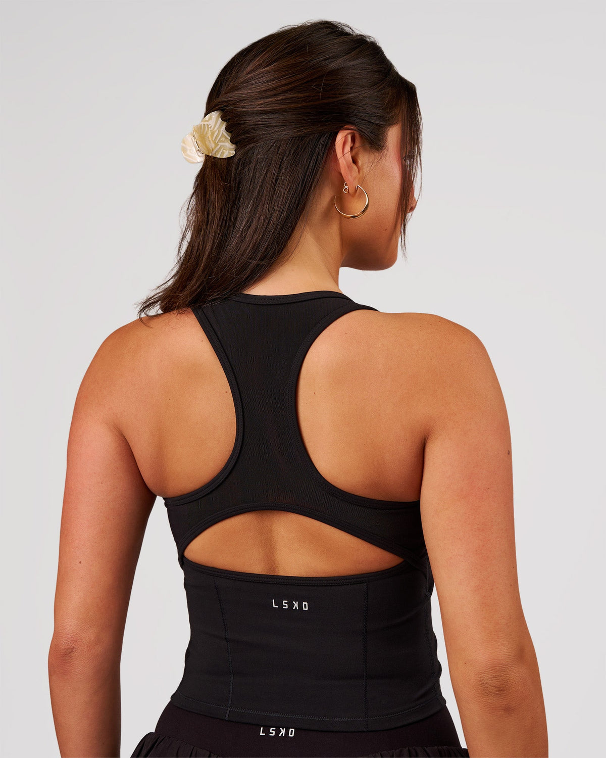 Woman wearing Aura Mesh Shelf Bra Tank - Black | Model:Bianca | Size:S