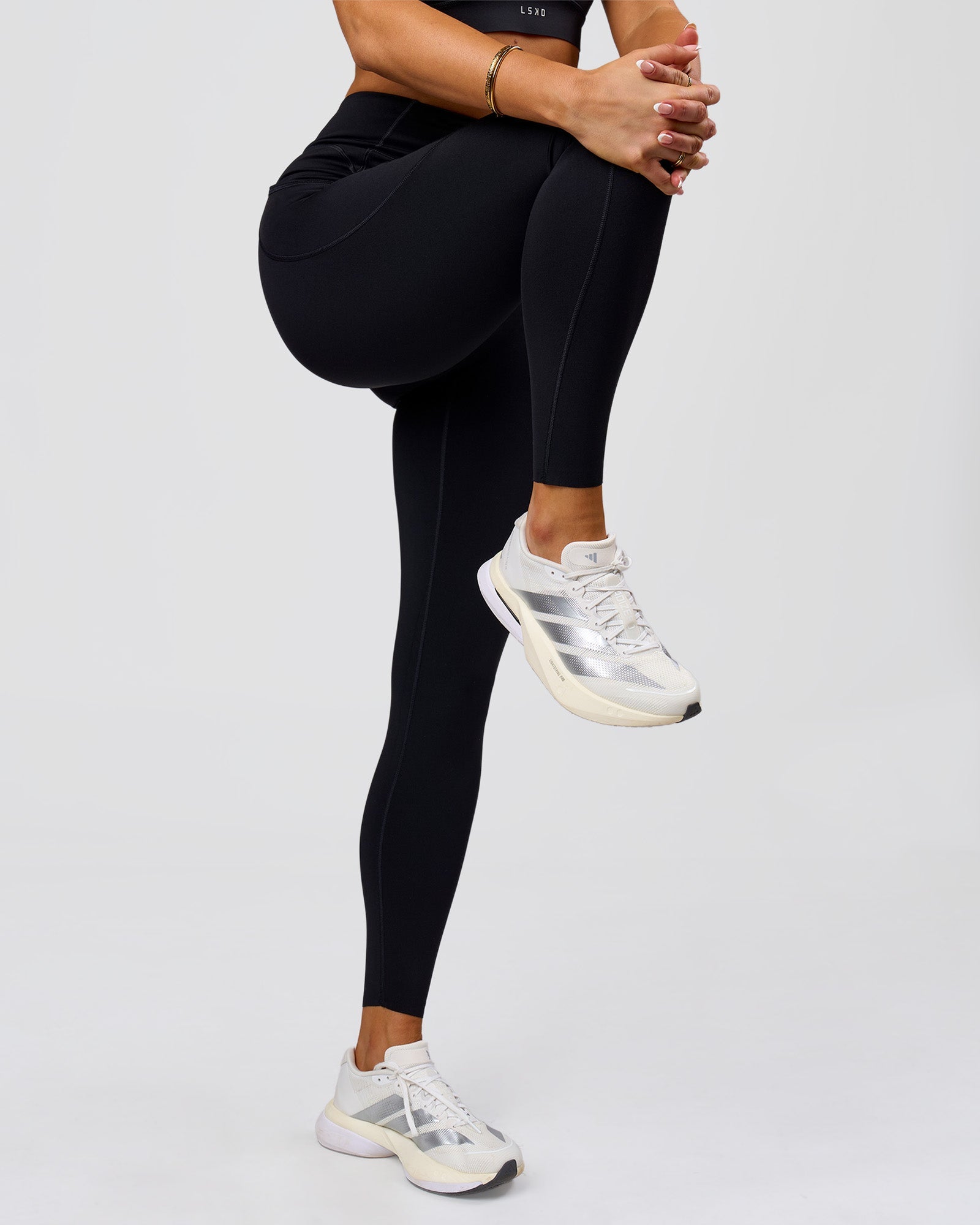 Woman wearing Elite Run High-Rise Full Length Legging Pockets - Black | Model:Bianca | Size:S