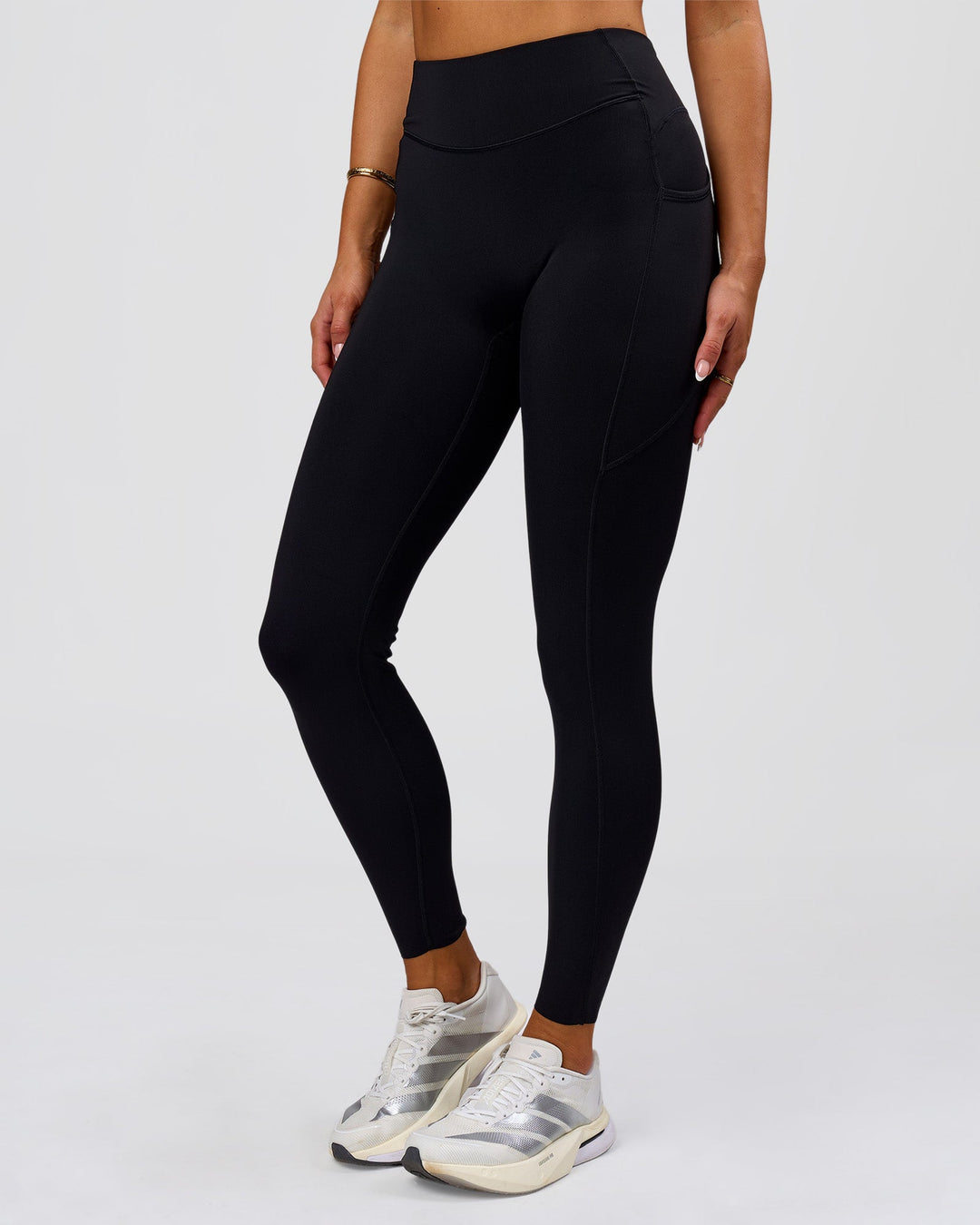 Woman wearing Elite Run High-Rise Full Length Legging Pockets - Black | Model:Bianca | Size:S - view 12