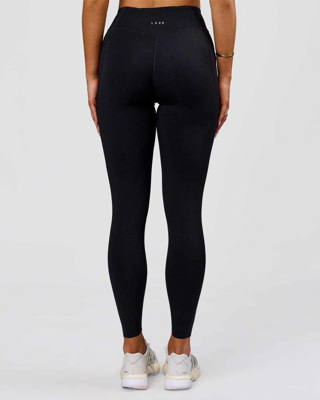 Woman wearing Elite Run High-Rise Full Length Legging Pockets - Black | Model:Bianca | Size:S - view 14