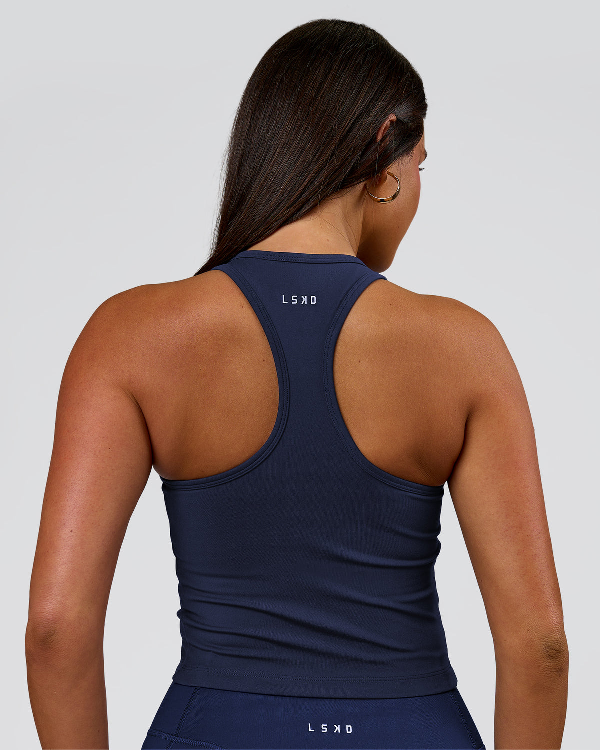 Woman wearing Flow Performance Shelf Bra Tank 2.0 - Future Navy | Model:Bianca | Size:S - view 2