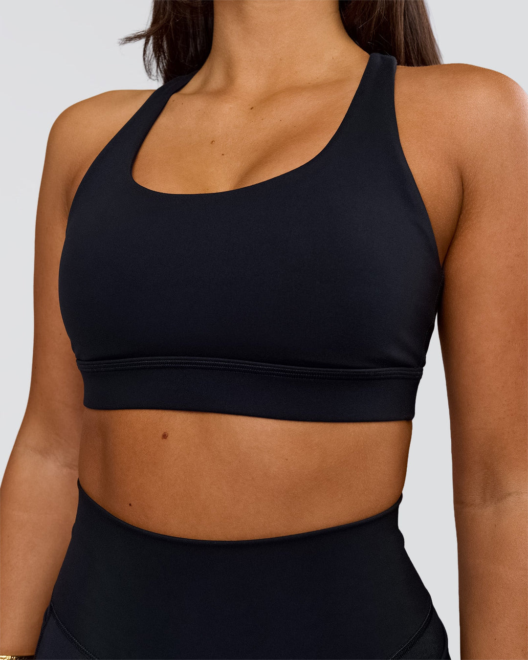 Woman wearing Flow Sports Bra - Black | Model:Bianca | Size:S - view 3