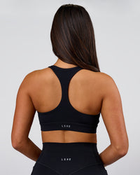 Woman wearing Flow Sports Bra - Black | Model:Bianca | Size:S | Thumbnail Index: 1