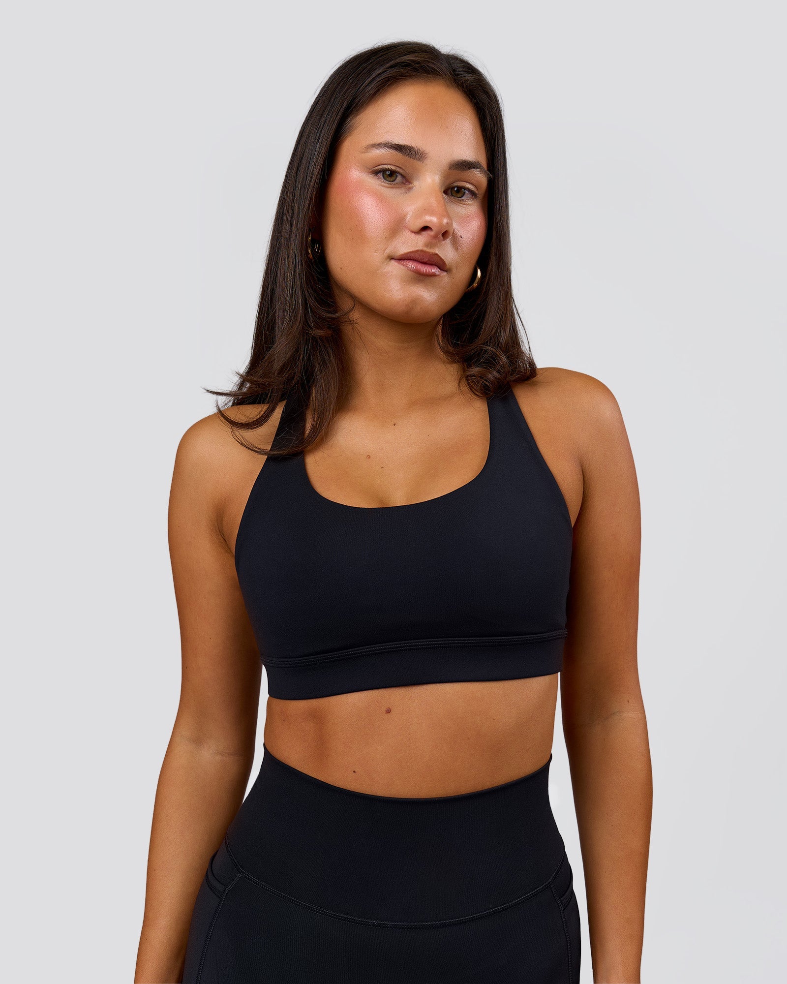 Woman wearing Flow Sports Bra - Black | Model:Bianca | Size:S