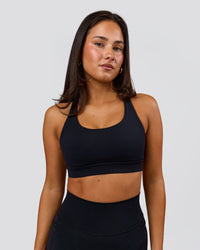 Woman wearing Flow Sports Bra - Black | Model:Bianca | Size:S | Thumbnail Index: 0