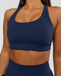Woman wearing Flow Sports Bra - Future Navy | Model:Bianca | Size:S | Thumbnail Index: 1