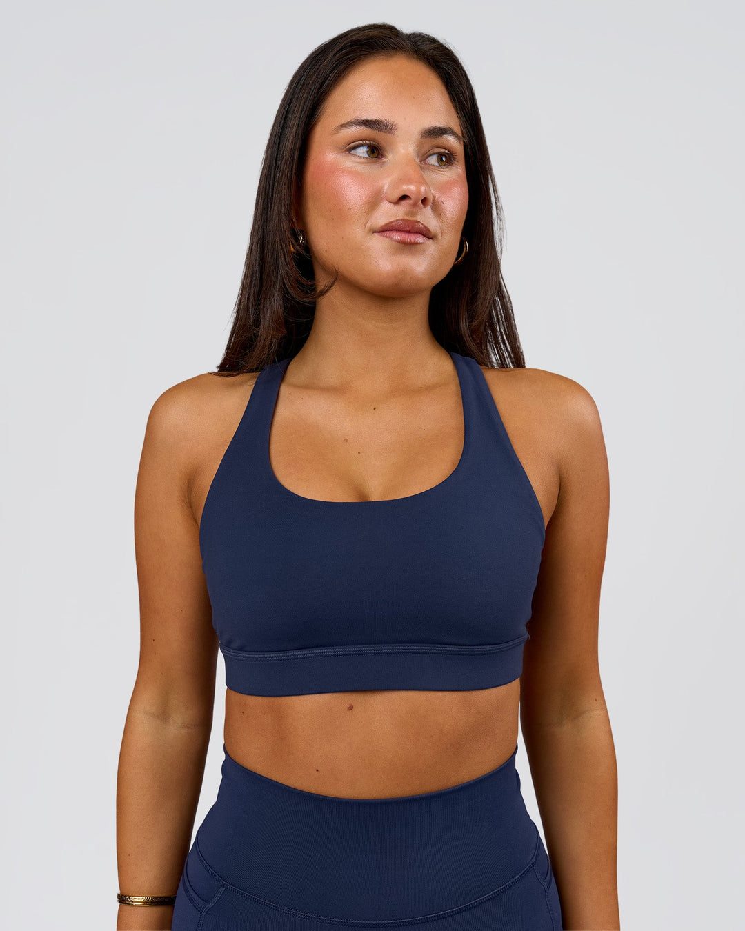Woman wearing Flow Sports Bra - Future Navy | Model:Bianca | Size:S - view 1