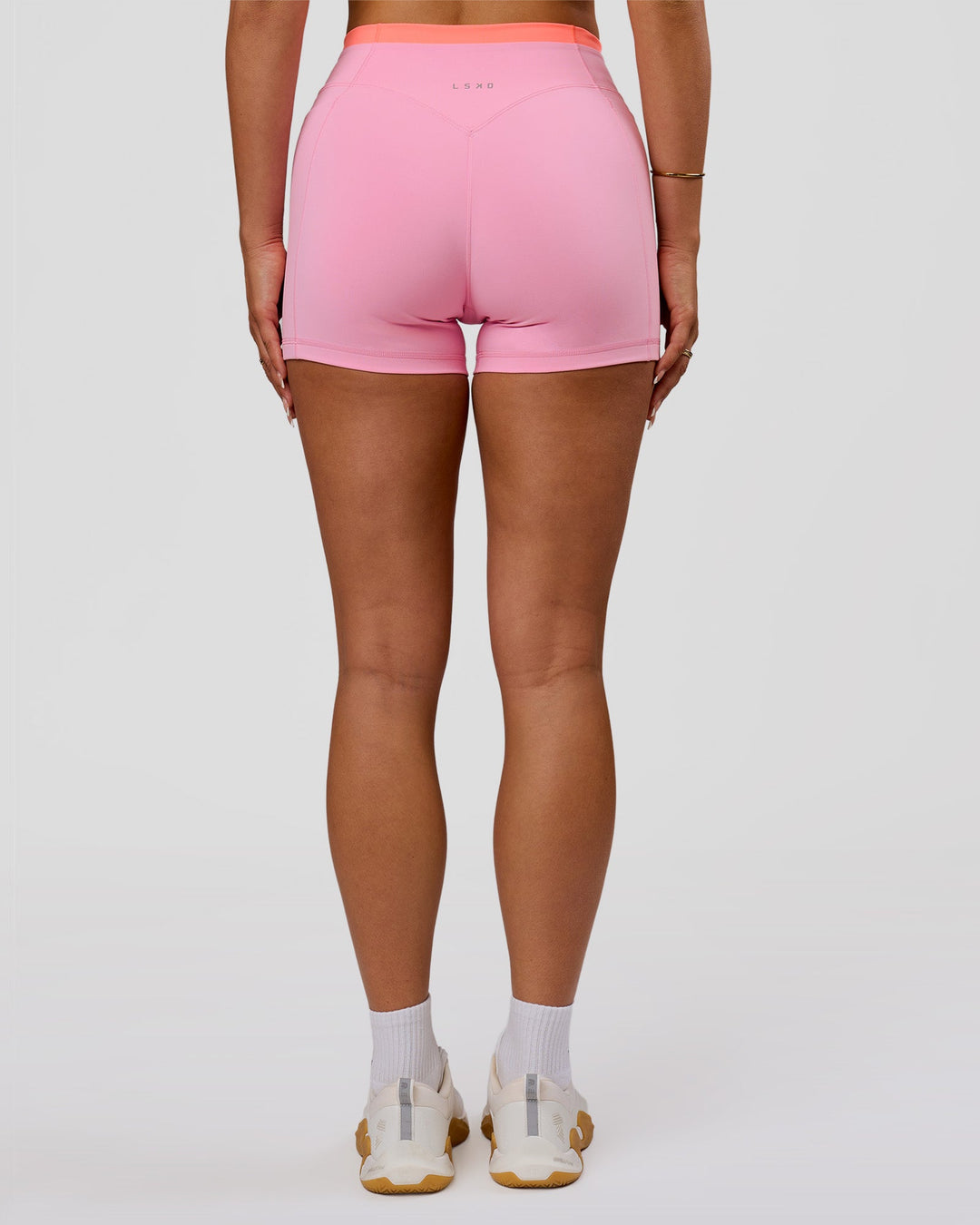 Woman wearing Fusion Contrast V-Waist High-Rise 4" Short Pockets - Pink Rose-Hyper Orange | Model:Bianca | Size:S - view 4