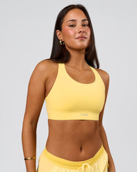Woman wearing Fusion Sports Bra 2.0 - Lemon | Model:Bianca | Size:S | Thumbnail Index: 0