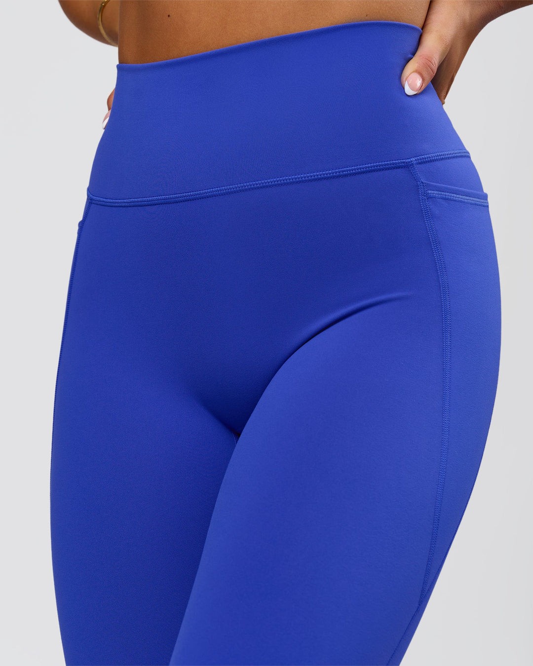 Woman wearing Fusion V-Contour Ultra High-Rise Full Length Legging Pockets - Power Cobalt | Model:Bianca | Size:S - view 4