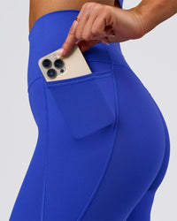 Woman wearing Fusion V-Contour Ultra High-Rise Full Length Legging Pockets - Power Cobalt | Model:Bianca | Size:S | Thumbnail Index: 4