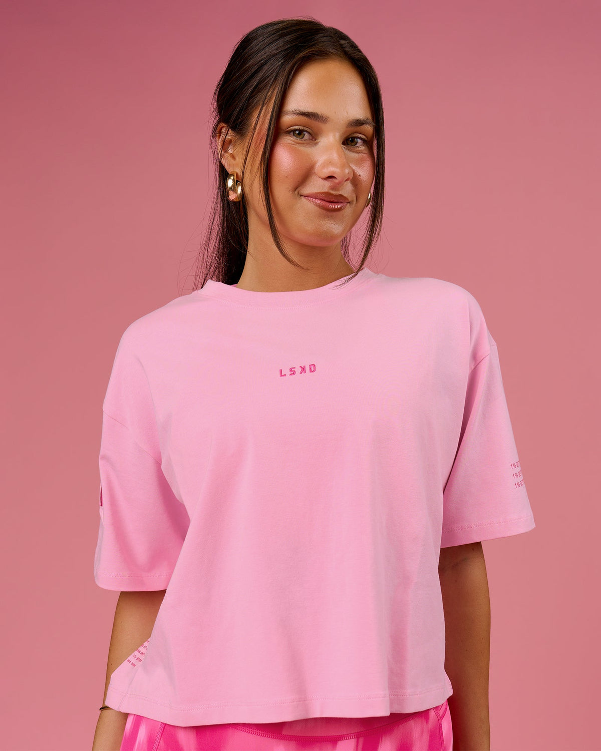 Woman wearing Go-To Heavyweight FLXCotton Graphic Skimmer Tee - Pink Rose-We Rise | Model:Bianca | Size:S