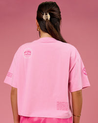 Woman wearing Go-To Heavyweight FLXCotton Graphic Skimmer Tee - Pink Rose-We Rise | Model:Bianca | Size:S | Thumbnail Index: 3