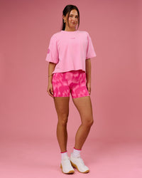 Woman wearing Go-To Heavyweight FLXCotton Graphic Skimmer Tee - Pink Rose-We Rise | Model:Bianca | Size:S | Thumbnail Index: 4