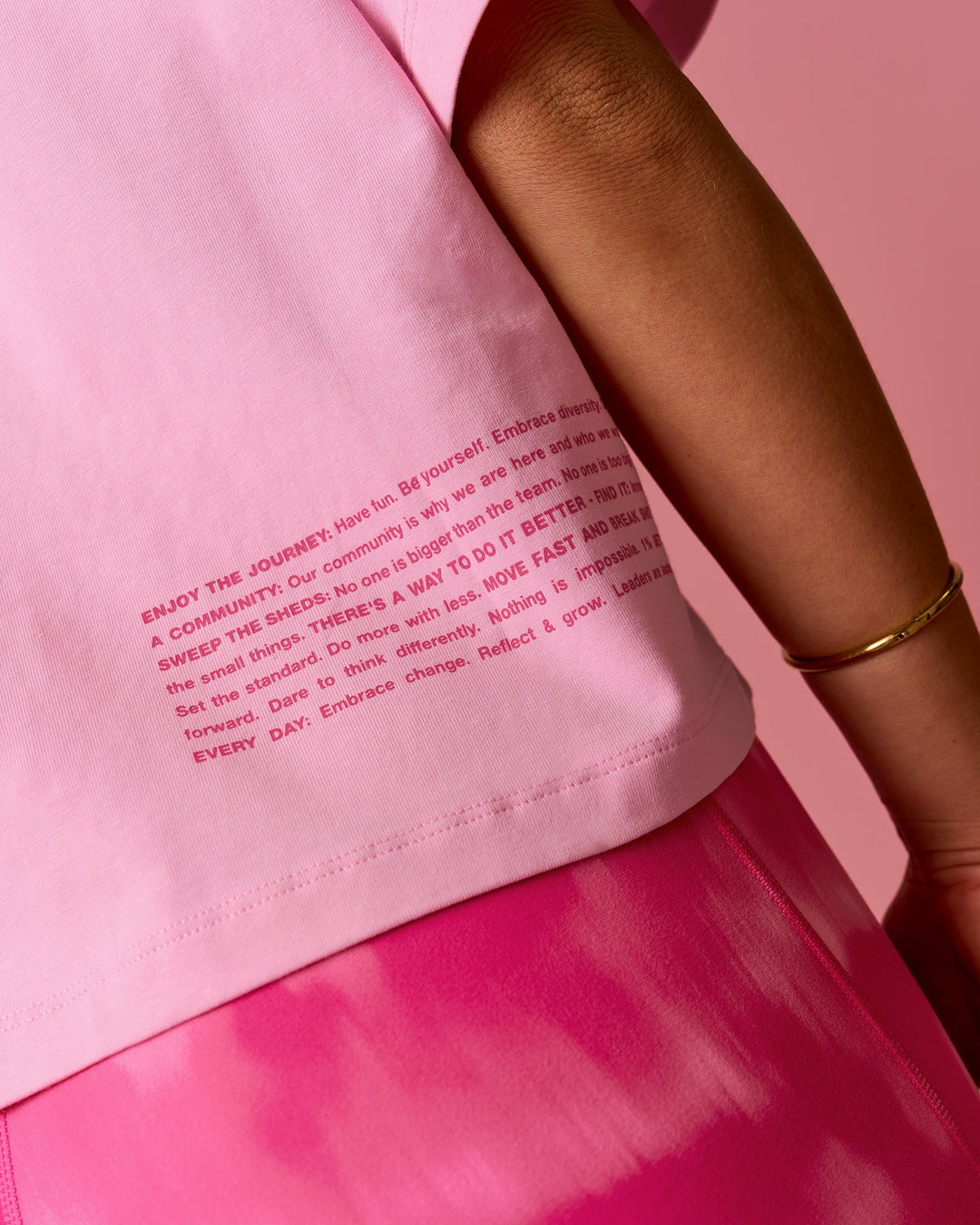 Woman wearing Go-To Heavyweight FLXCotton Graphic Skimmer Tee - Pink Rose-We Rise | Model:Bianca | Size:S - view 2