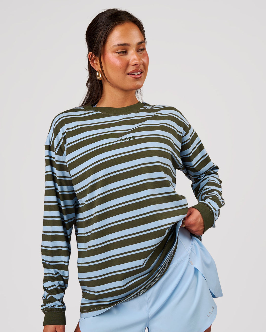 Woman wearing Go-To Shadow Stripe Long Sleeve FLXCotton Oversized Tee - Pure Olive-Open Air | Model:Bianca | Size:S - view 1