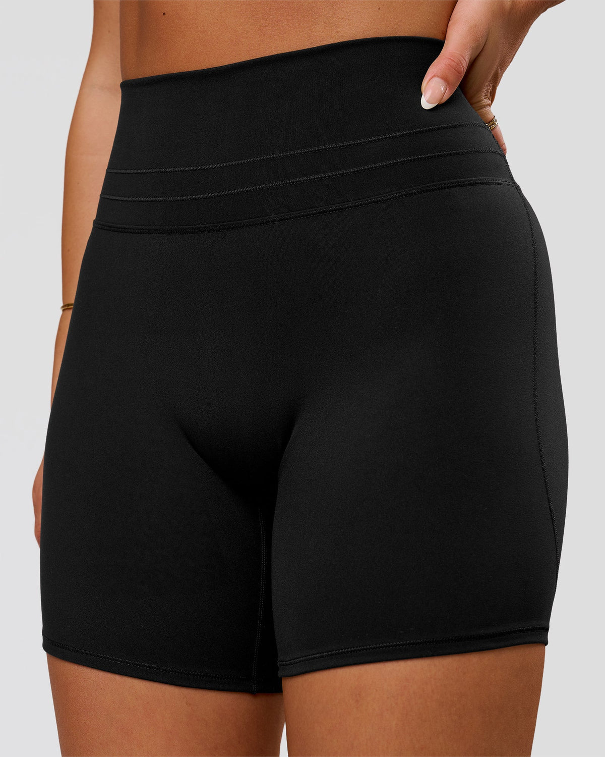 Woman wearing Luxe V-Contour High-Rise 6" Short - Black | Model:Bianca | Size:S