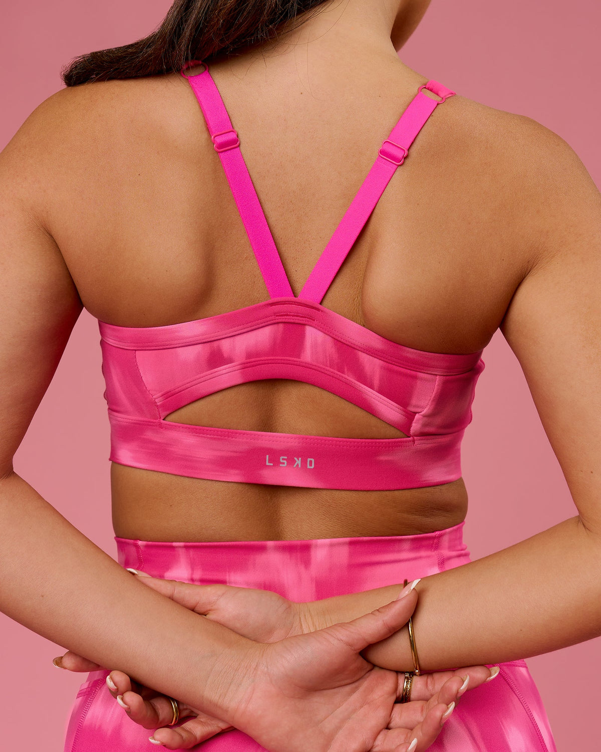 Woman wearing Momentum Sports Bra D/DD/E - Radiant Pink | Model:Bianca | Size:S
