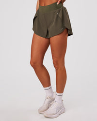 Woman wearing Pacer 3" Run Short - Pure Olive | Model:Bianca | Size:S | Thumbnail Index: 1