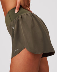 Woman wearing Pacer 3" Run Short - Pure Olive | Model:Bianca | Size:S | Thumbnail Index: 2