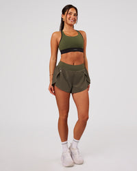 Woman wearing Pacer 3" Run Short - Pure Olive | Model:Bianca | Size:S | Thumbnail Index: 4