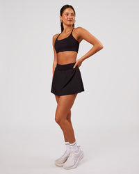 Woman wearing Pacer Skirt - Black | Model:Bianca | Size:S | Thumbnail Index: 2
