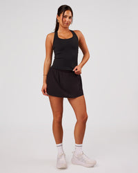 Woman wearing Pacer Skirt - Black | Model:Bianca | Size:S | Thumbnail Index: 4