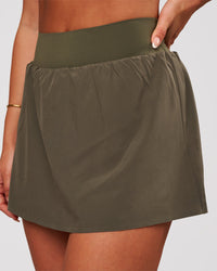 Woman wearing Pacer Skirt - Pure Olive | Model:Bianca | Size:S | Thumbnail Index: 0