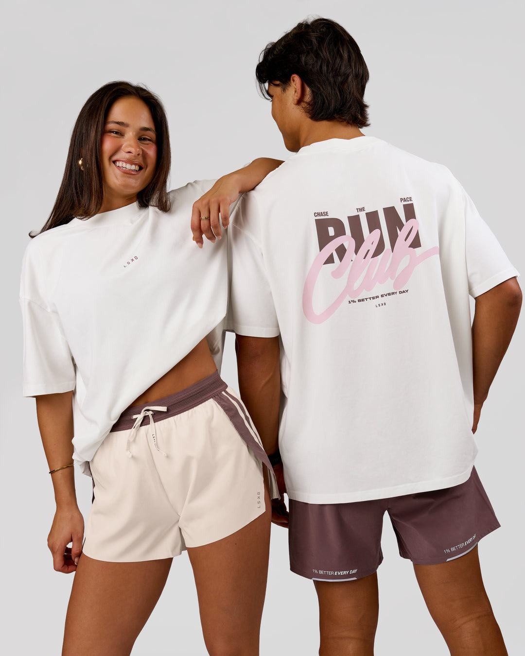 Woman wearing Run Club Unisex Oversized Heavyweight FLXCotton Tee - Off White | Model:Bianca | Size:S - view 1