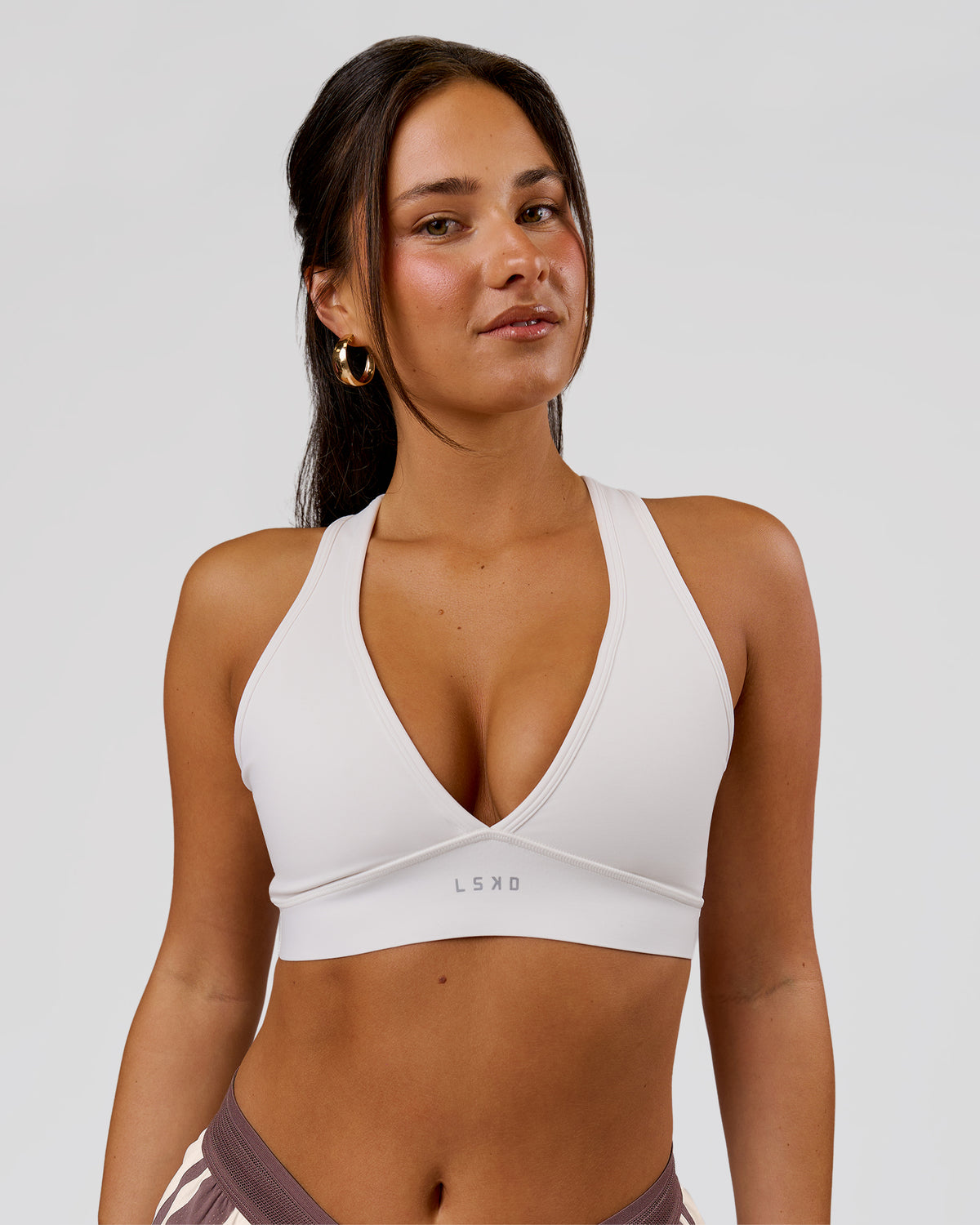 Woman wearing Stamina Sports Bra - Off White | Model:Bianca | Size:S - view 1