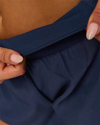 Woman wearing Tia-Clair Toomey-Orr Accelerate 3" Storage Running Short - Future Navy | Model:Bianca | Size:S | Thumbnail Index: 7