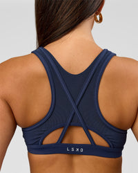 Woman wearing Unstoppable Racerback Sports Bra - Future Navy | Model:Bianca | Size:S | Thumbnail Index: 7