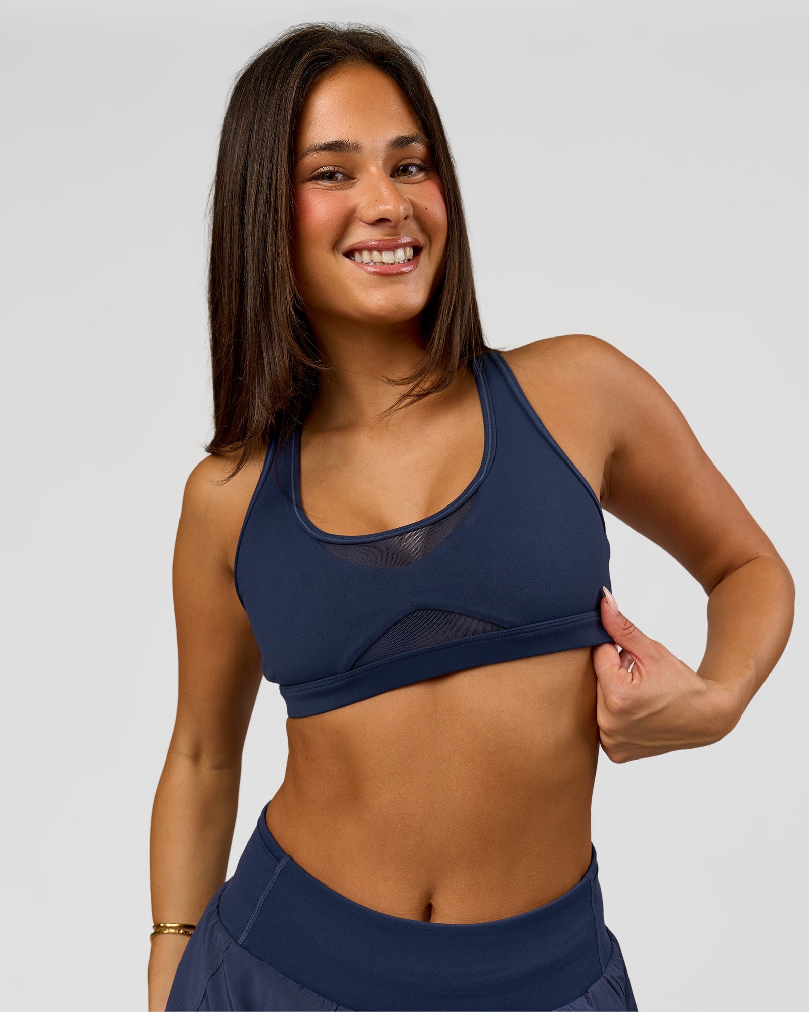 Woman wearing Unstoppable Racerback Sports Bra - Future Navy | Model:Bianca | Size:S