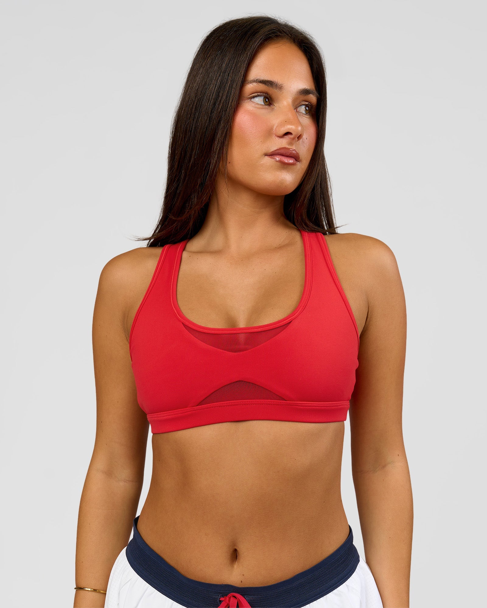 Woman wearing Unstoppable Racerback Sports Bra - Scarlet | Model:Bianca | Size:S