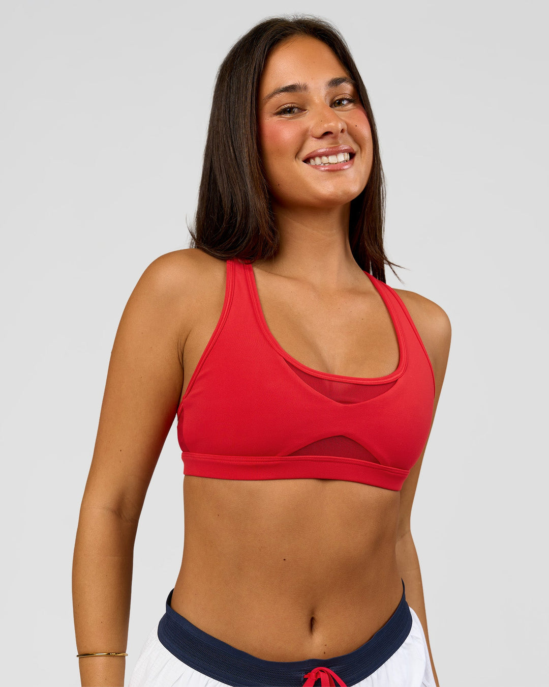 Woman wearing Unstoppable Racerback Sports Bra - Scarlet | Model:Bianca | Size:S - view 9
