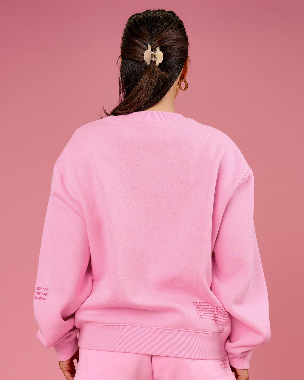Woman wearing We Rise Oversized Sweater - Pink Rose-We Rise | Model:Bianca | Size:S