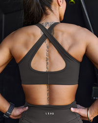 Woman wearing Stamina Sports Bra - Onyx | Model:Chelsea | Size:S | Thumbnail Index: 6