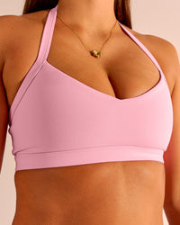 Woman wearing Unleash Sports Bra - Pink Rose | Model:Emma | Size:S | Thumbnail Index: 0