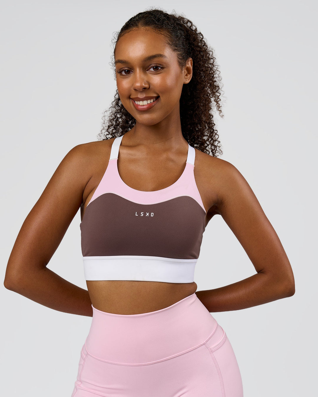 Woman wearing Elevated Accelerate Sports Bra - Cocoa Powder-Marshmallow-White | Model:Jordan | Size:S - view 3
