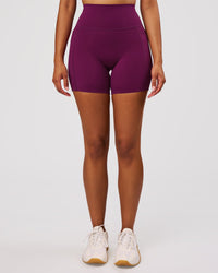 Woman wearing Elixir High-Rise 6" Short Pockets - Plum Caspia | Model:Jordan | Size:S | Thumbnail Index: 7