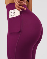 Woman wearing Elixir High-Rise Full Length Legging Pockets - Plum Caspia | Model:Jordan | Size:S | Thumbnail Index: 4