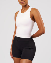 Woman wearing Flow Performance Tank 2.0 - White | Model:Jordan | Size:S | Thumbnail Index: 4