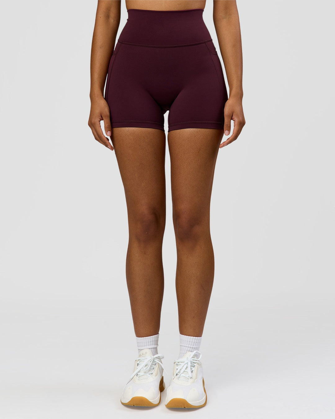 Woman wearing Fusion Ultra High-Rise 4" Short Pockets - Cherry Lacquer | Model:Jordan | Size:S - view 6