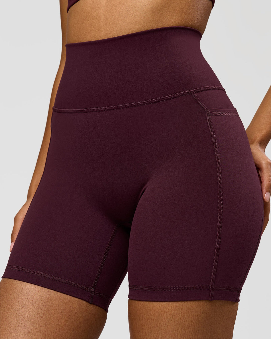 Woman wearing Fusion Ultra High-Rise 6" Short Pockets - Cherry Lacquer | Model:Jordan | Size:S - view 2